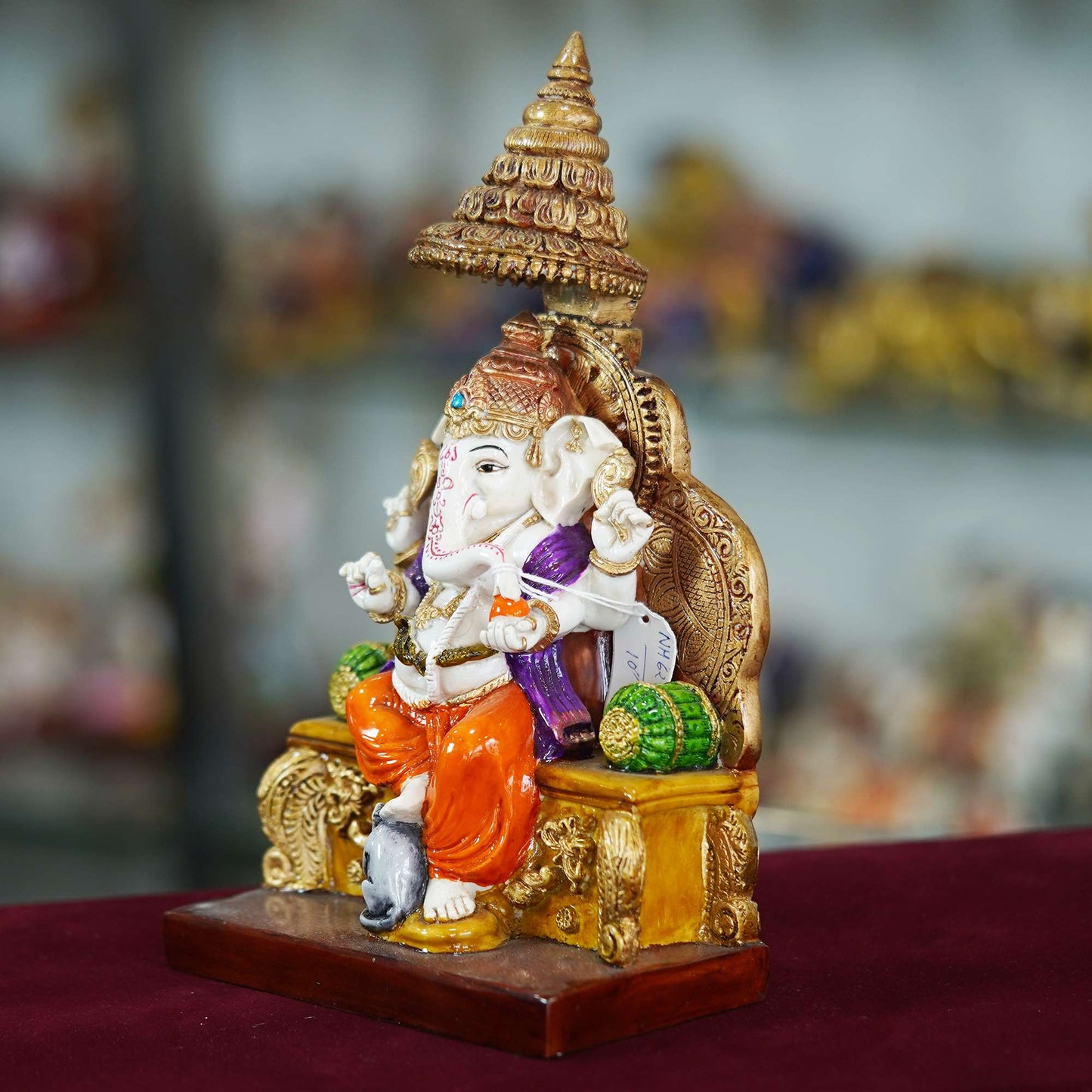 Majestic Lord Ganesha Idol Seated on Throne – Vibrant Hand-Painted Decorative Statue