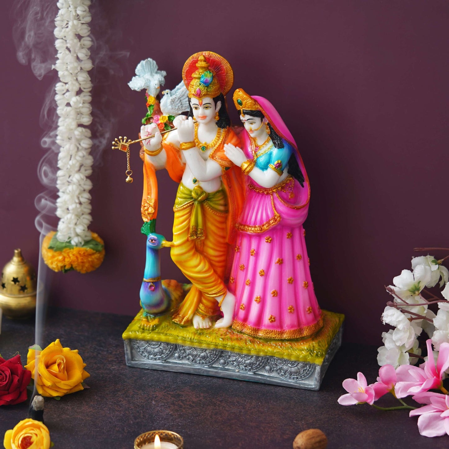 Colorful Radha Krishna Idol – Hand-Painted Decorative Statue with Peacock Detail
