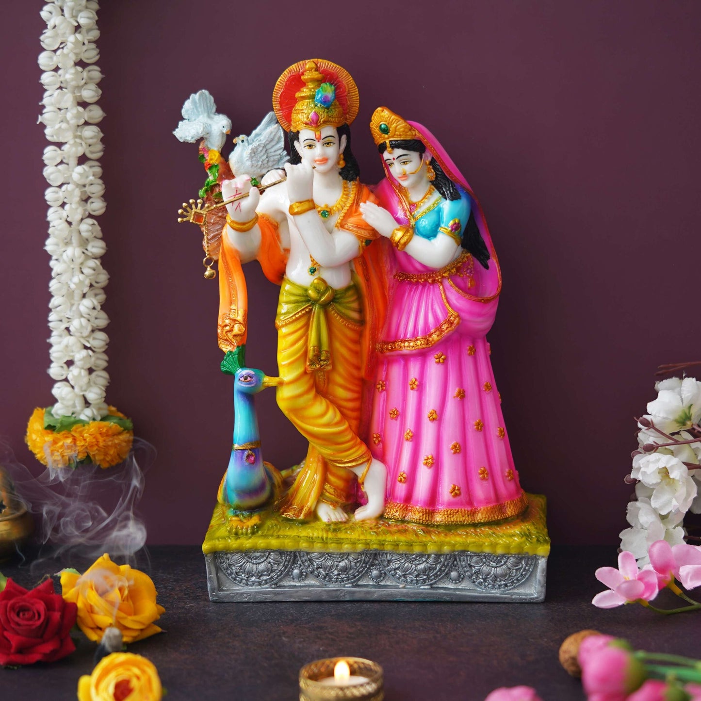 Colorful Radha Krishna Idol – Hand-Painted Decorative Statue with Peacock Detail